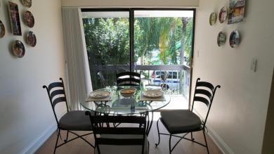 A 2nd floor experience offering stunning water views, great room on Boca West Golf and Country Club in Florida - for sale on GolfHomes.com, golf home, golf lot