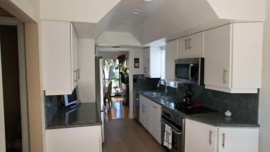 A 2nd floor experience offering stunning water views, great room on Boca West Golf and Country Club in Florida - for sale on GolfHomes.com, golf home, golf lot