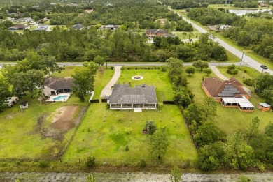 A RARE FIND! Welcome to a rare solar-powered retreat in the on Wedgefield Golf Club in Florida - for sale on GolfHomes.com, golf home, golf lot