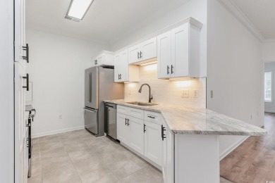This is a beautifully upgraded end-unit 3-bedroom/2-bathroom on Heron Point Golf Club in South Carolina - for sale on GolfHomes.com, golf home, golf lot