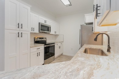 This is a beautifully upgraded end-unit 3-bedroom/2-bathroom on Heron Point Golf Club in South Carolina - for sale on GolfHomes.com, golf home, golf lot