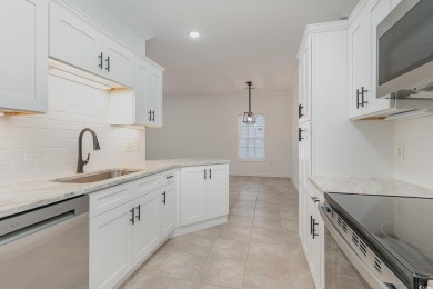 This is a beautifully upgraded end-unit 3-bedroom/2-bathroom on Heron Point Golf Club in South Carolina - for sale on GolfHomes.com, golf home, golf lot
