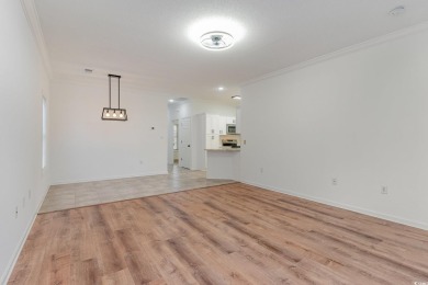 This is a beautifully upgraded end-unit 3-bedroom/2-bathroom on Heron Point Golf Club in South Carolina - for sale on GolfHomes.com, golf home, golf lot