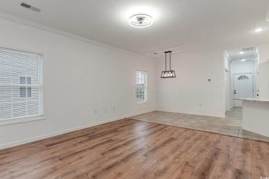 This is a beautifully upgraded end-unit 3-bedroom/2-bathroom on Heron Point Golf Club in South Carolina - for sale on GolfHomes.com, golf home, golf lot