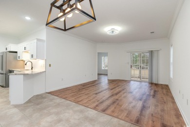 This is a beautifully upgraded end-unit 3-bedroom/2-bathroom on Heron Point Golf Club in South Carolina - for sale on GolfHomes.com, golf home, golf lot