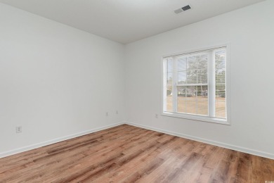 This is a beautifully upgraded end-unit 3-bedroom/2-bathroom on Heron Point Golf Club in South Carolina - for sale on GolfHomes.com, golf home, golf lot