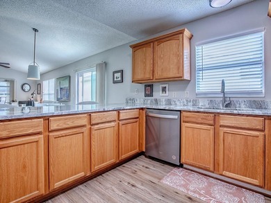 LOCATION is everything with this 2/2 block and stucco Woodlawn on Bacall Executive Golf Course in Florida - for sale on GolfHomes.com, golf home, golf lot