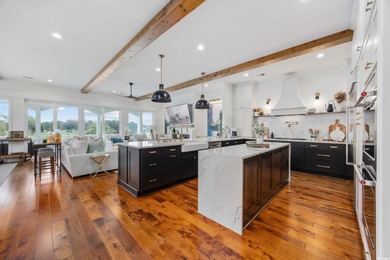 Welcome home to 400 W. Palms Drive, where waterway living is on Myrtlewood Golf Course and Club  in South Carolina - for sale on GolfHomes.com, golf home, golf lot