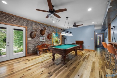 Discover this unique lodge-style home on Gunter's Landing Golf on Gunters Landing in Alabama - for sale on GolfHomes.com, golf home, golf lot