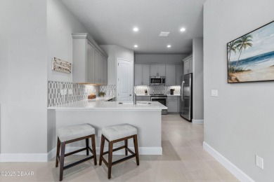 Stunning Maintenance-Free Townhome in Gated Plantation Bay on Plantation Bay Golf and Country Club in Florida - for sale on GolfHomes.com, golf home, golf lot