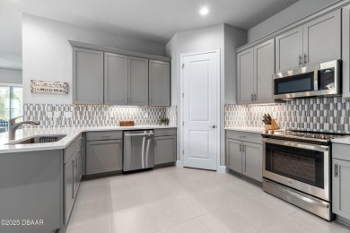 Stunning Maintenance-Free Townhome in Gated Plantation Bay on Plantation Bay Golf and Country Club in Florida - for sale on GolfHomes.com, golf home, golf lot