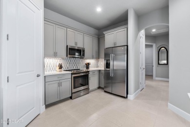 Stunning Maintenance-Free Townhome in Gated Plantation Bay on Plantation Bay Golf and Country Club in Florida - for sale on GolfHomes.com, golf home, golf lot