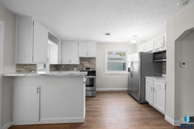 Cute as a button! This quaint one-level home is sure to impress on Elmwood Park Golf Course in South Dakota - for sale on GolfHomes.com, golf home, golf lot