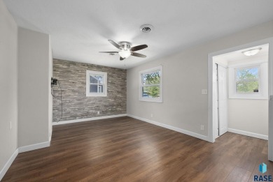 Cute as a button! This quaint one-level home is sure to impress on Elmwood Park Golf Course in South Dakota - for sale on GolfHomes.com, golf home, golf lot