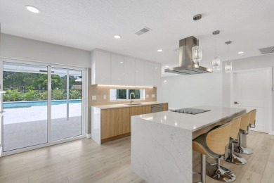 Welcome to this fully reimagined South Florida masterpiece! This on Lakeview Golf Club in Florida - for sale on GolfHomes.com, golf home, golf lot