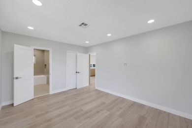 Welcome to this fully reimagined South Florida masterpiece! This on Lakeview Golf Club in Florida - for sale on GolfHomes.com, golf home, golf lot