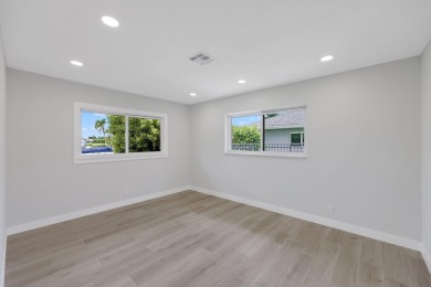 Welcome to this fully reimagined South Florida masterpiece! This on Lakeview Golf Club in Florida - for sale on GolfHomes.com, golf home, golf lot