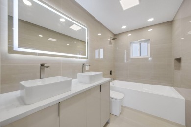 Welcome to this fully reimagined South Florida masterpiece! This on Lakeview Golf Club in Florida - for sale on GolfHomes.com, golf home, golf lot