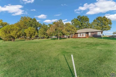 Come fall in love with this well maintained ranch-style home! on Topeka Country Club in Kansas - for sale on GolfHomes.com, golf home, golf lot