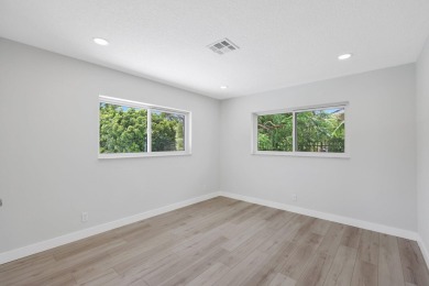 Welcome to this fully reimagined South Florida masterpiece! This on Lakeview Golf Club in Florida - for sale on GolfHomes.com, golf home, golf lot