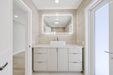 Welcome to this fully reimagined South Florida masterpiece! This on Lakeview Golf Club in Florida - for sale on GolfHomes.com, golf home, golf lot