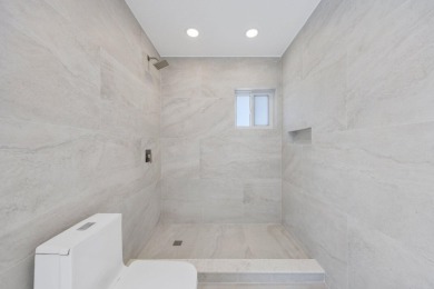 Welcome to this fully reimagined South Florida masterpiece! This on Lakeview Golf Club in Florida - for sale on GolfHomes.com, golf home, golf lot