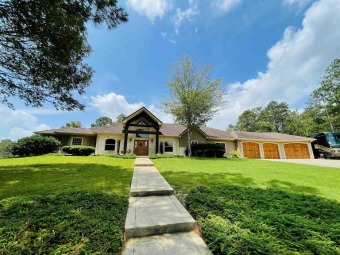 Custom Retreat on hilltop acreage overlooking Rayburn Country's on Rayburn Country Club in Texas - for sale on GolfHomes.com, golf home, golf lot