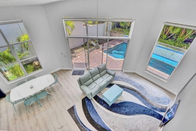 Light & open, this lovely 2-story home of 3 bedrooms & 2 1/2 on Woodfield Country Club in Florida - for sale on GolfHomes.com, golf home, golf lot