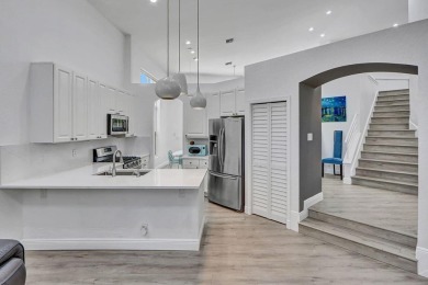 Light & open, this lovely 2-story home of 3 bedrooms & 2 1/2 on Woodfield Country Club in Florida - for sale on GolfHomes.com, golf home, golf lot