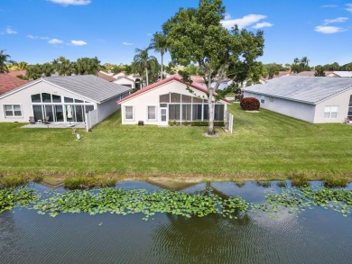 Welcome to this stunning lake-view home in the serene community on Westchester Golf and Country Club in Florida - for sale on GolfHomes.com, golf home, golf lot