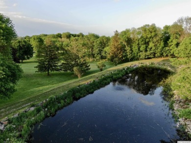 This stunning 3.7-acre in-town acreage offers the perfect blend on Oak Hills Golf Course in Iowa - for sale on GolfHomes.com, golf home, golf lot