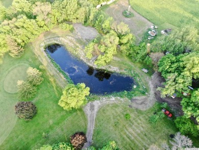 This stunning 3.7-acre in-town acreage offers the perfect blend on Oak Hills Golf Course in Iowa - for sale on GolfHomes.com, golf home, golf lot