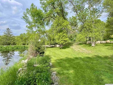 This stunning 3.7-acre in-town acreage offers the perfect blend on Oak Hills Golf Course in Iowa - for sale on GolfHomes.com, golf home, golf lot