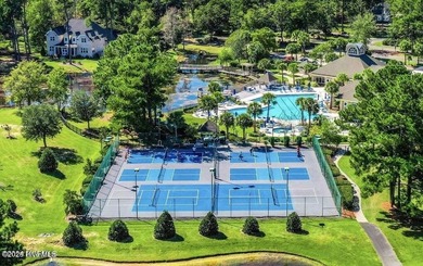 Discover the charm of Anchor, a 4-bed, 3.5-bath coastal home on Sea Trail Golf Resort in North Carolina - for sale on GolfHomes.com, golf home, golf lot