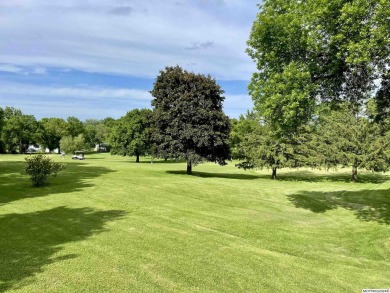 This stunning 3.7-acre in-town acreage offers the perfect blend on Oak Hills Golf Course in Iowa - for sale on GolfHomes.com, golf home, golf lot