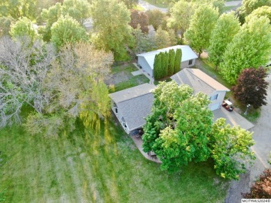 This stunning 3.7-acre in-town acreage offers the perfect blend on Oak Hills Golf Course in Iowa - for sale on GolfHomes.com, golf home, golf lot