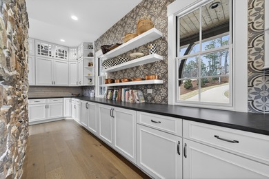 Welcome to this beautiful custom-built, 4-bedroom, 4.5-bath lake on Reynolds Lake Oconee - The Oconee in Georgia - for sale on GolfHomes.com, golf home, golf lot