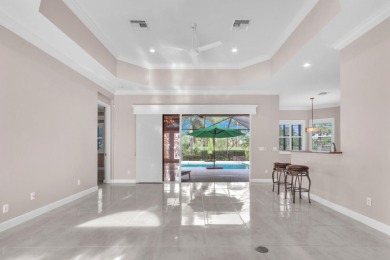 BREATHTAKING GOLF & WATER VIEWS! Experience refined living in on The Legacy Golf and Tennis Club in Florida - for sale on GolfHomes.com, golf home, golf lot