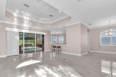 BREATHTAKING GOLF & WATER VIEWS! Experience refined living in on The Legacy Golf and Tennis Club in Florida - for sale on GolfHomes.com, golf home, golf lot