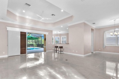 BREATHTAKING GOLF & WATER VIEWS! Experience refined living in on The Legacy Golf and Tennis Club in Florida - for sale on GolfHomes.com, golf home, golf lot