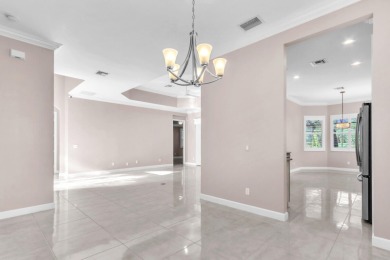 BREATHTAKING GOLF & WATER VIEWS! Experience refined living in on The Legacy Golf and Tennis Club in Florida - for sale on GolfHomes.com, golf home, golf lot