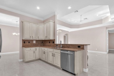 BREATHTAKING GOLF & WATER VIEWS! Experience refined living in on The Legacy Golf and Tennis Club in Florida - for sale on GolfHomes.com, golf home, golf lot