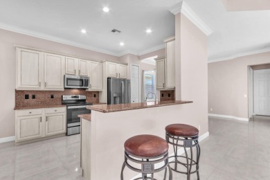 BREATHTAKING GOLF & WATER VIEWS! Experience refined living in on The Legacy Golf and Tennis Club in Florida - for sale on GolfHomes.com, golf home, golf lot