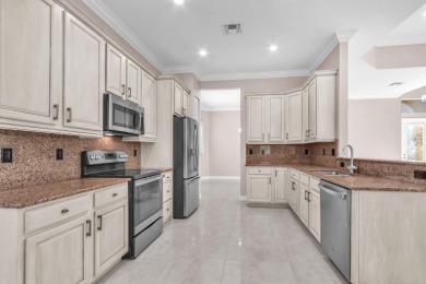 BREATHTAKING GOLF & WATER VIEWS! Experience refined living in on The Legacy Golf and Tennis Club in Florida - for sale on GolfHomes.com, golf home, golf lot