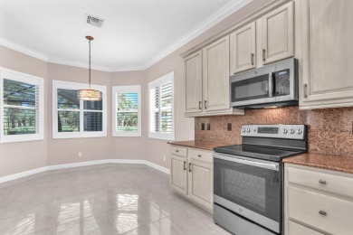 BREATHTAKING GOLF & WATER VIEWS! Experience refined living in on The Legacy Golf and Tennis Club in Florida - for sale on GolfHomes.com, golf home, golf lot