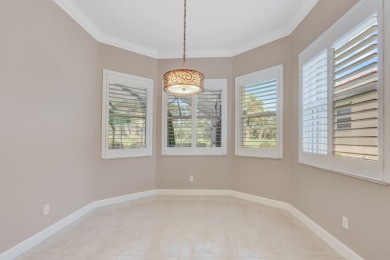 BREATHTAKING GOLF & WATER VIEWS! Experience refined living in on The Legacy Golf and Tennis Club in Florida - for sale on GolfHomes.com, golf home, golf lot
