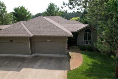 All the best of care-free condo living! Great room with gas on Michaywe Pines Course in Michigan - for sale on GolfHomes.com, golf home, golf lot