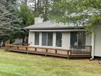 All the best of care-free condo living! Great room with gas on Michaywe Pines Course in Michigan - for sale on GolfHomes.com, golf home, golf lot