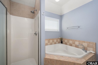 This vacation rental home is a spacious 4-bedroom, 4.5-bathroom on The Currituck Golf Club in North Carolina - for sale on GolfHomes.com, golf home, golf lot