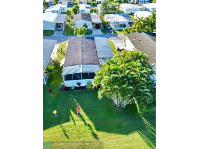 Welcome to your stunning 2-bedroom, 2-bath mobile home in the on Davie Golf Club in Florida - for sale on GolfHomes.com, golf home, golf lot